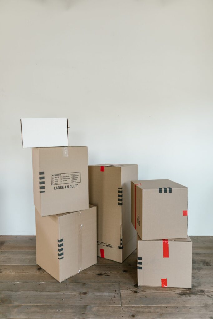 A pile of cardboard moving boxes that will eventually become post-consumer waste.